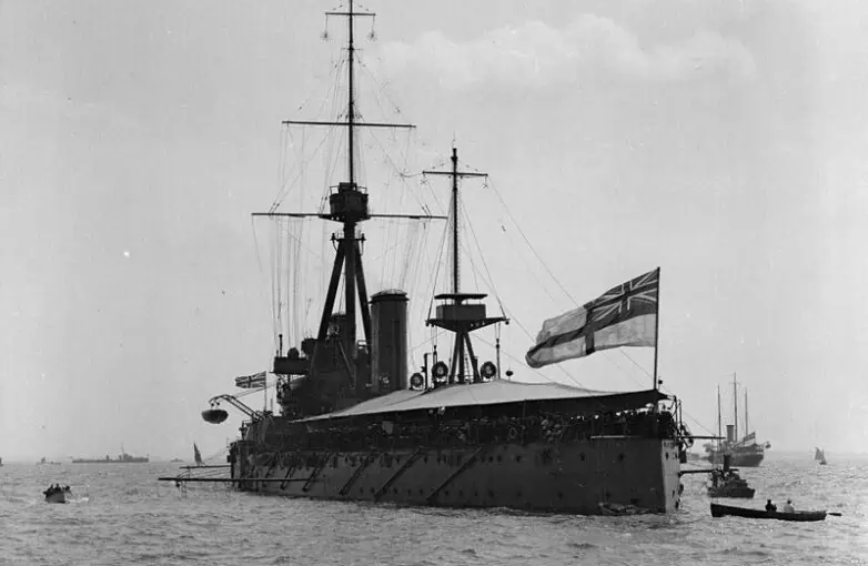 HMS Dreadnought (1906) with awning rigged, anchored in the Thames Estuary