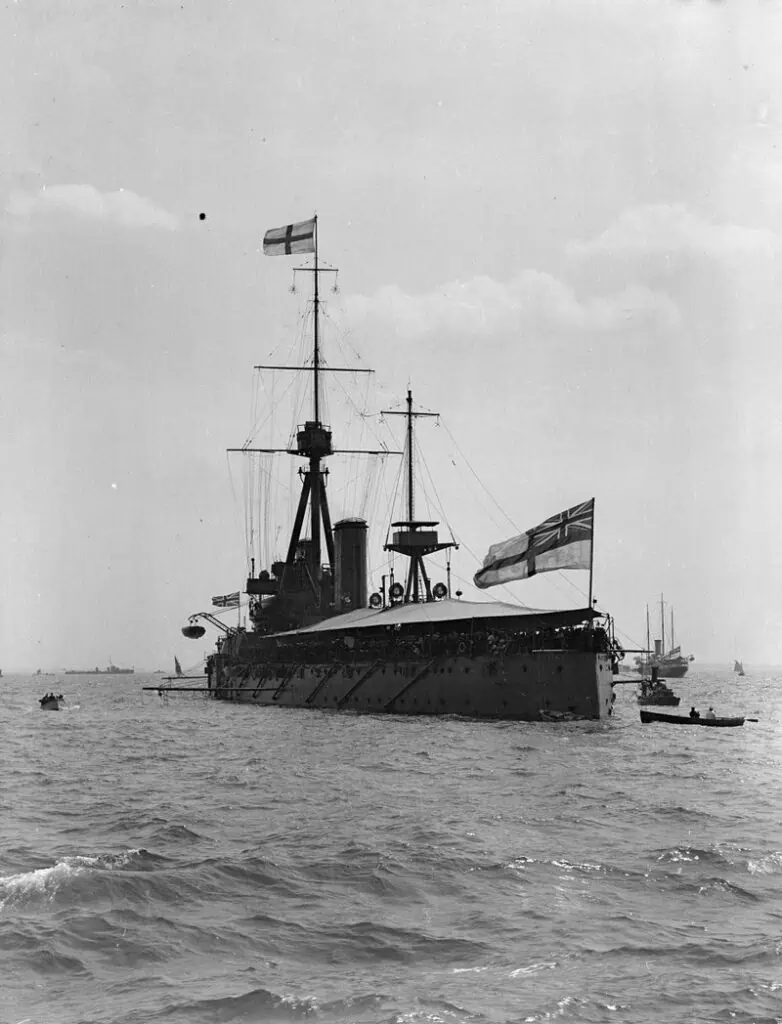 HMS Dreadnought (1906) with awning rigged, anchored in the Thames Estuary