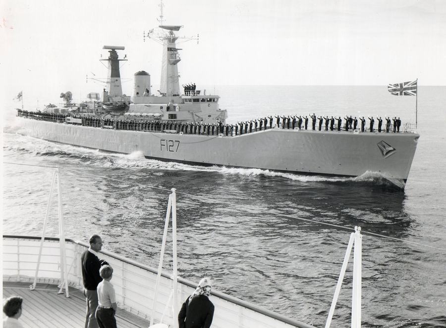 HMS Penelope rendering honours to The Queen & Prince Philip onboard HMY Britannia
